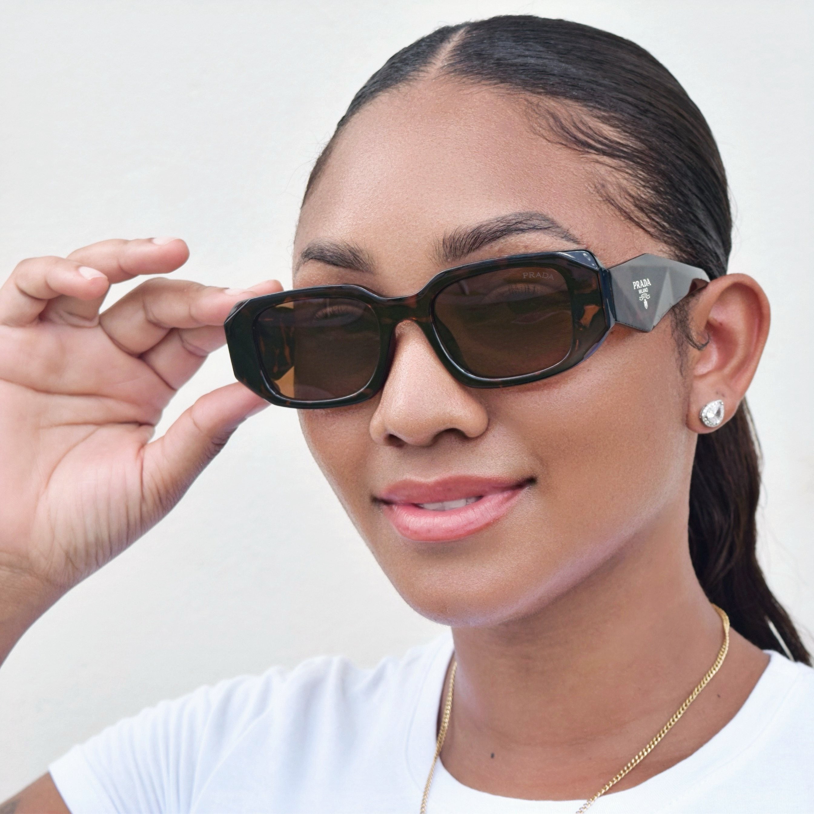 Geometric Rectangular Sunglasses with Thick Frames, Wide Temples, and Tinted Lenses
