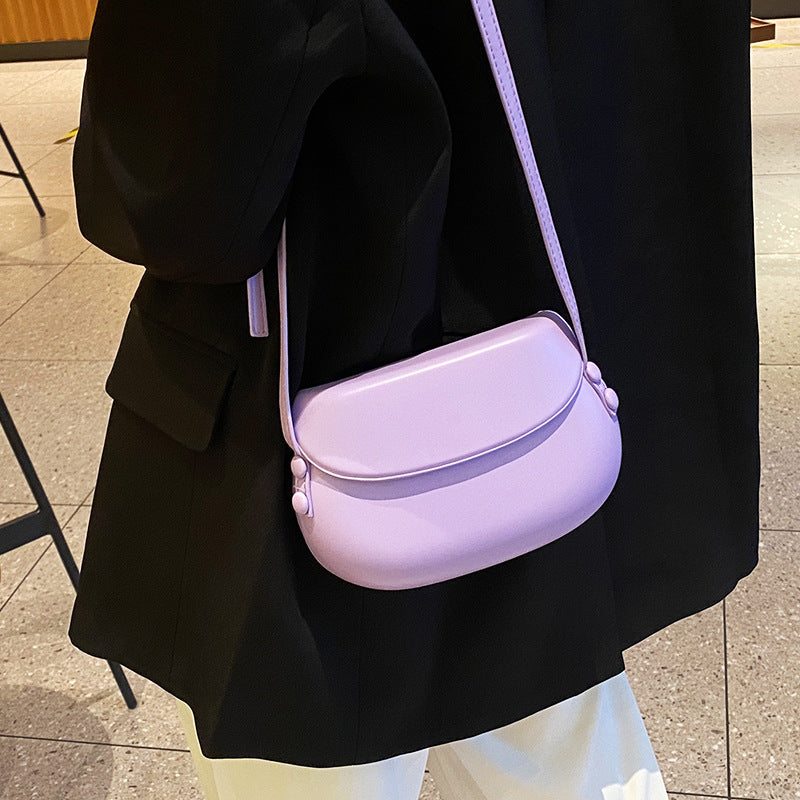 Curved Saddle Crossbody Bag with Flap Closure