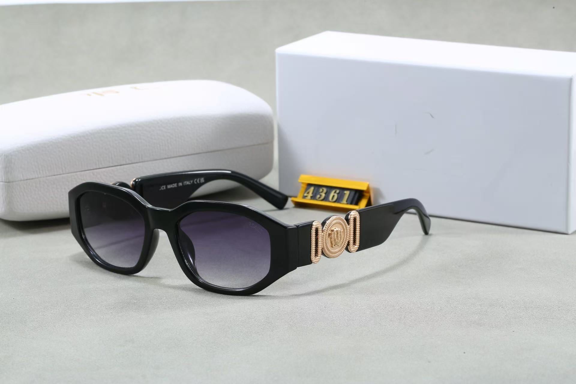 Black box frame sunglasses with rose gold temple emblem and UV protection lenses, shown with case and box.
