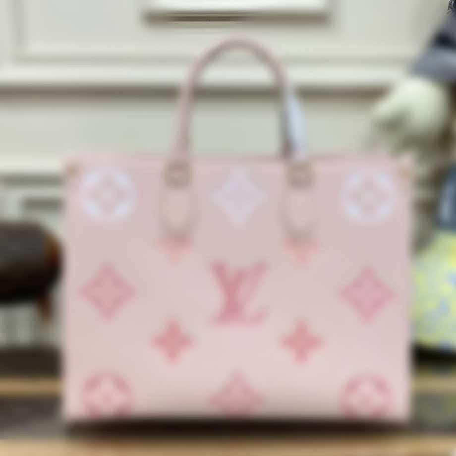 Pink leather tote bag featuring Louis Vuitton monogram pattern and dual rolled handles.