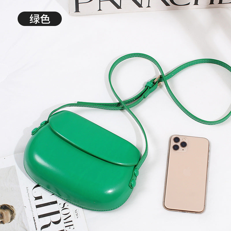 Curved Saddle Crossbody Bag with Flap Closure