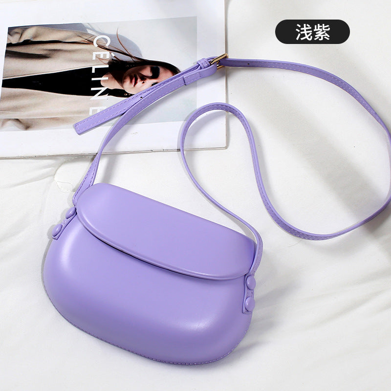 Curved Saddle Crossbody Bag with Flap Closure