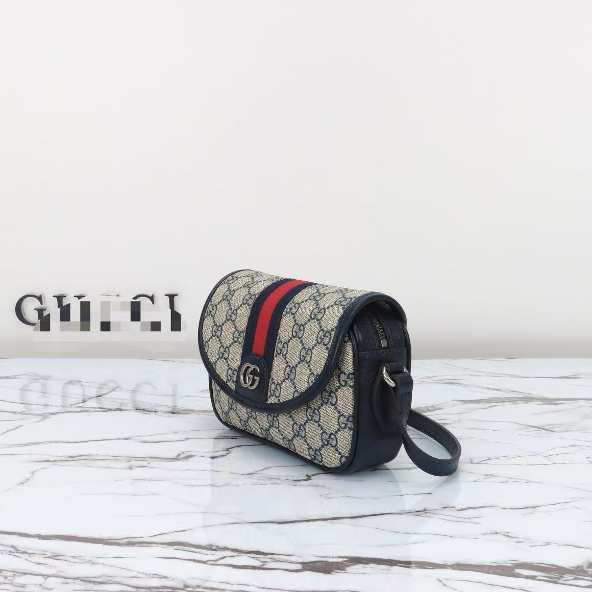 Compact Repeating Pattern Flap Crossbody Bag with Adjustable Strap