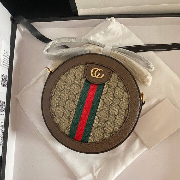 Timeless Circular Crossbody Bag With Structured Silhouette And Signature Stripe Panel Detail