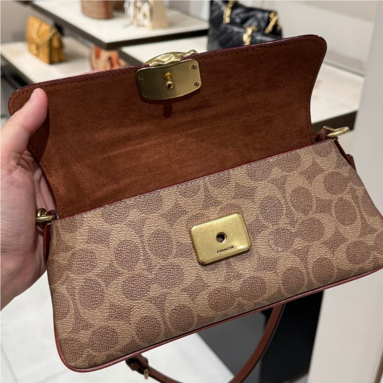 Compact Baguette Crossbody Bag with Adjustable Strap and Flap Closure