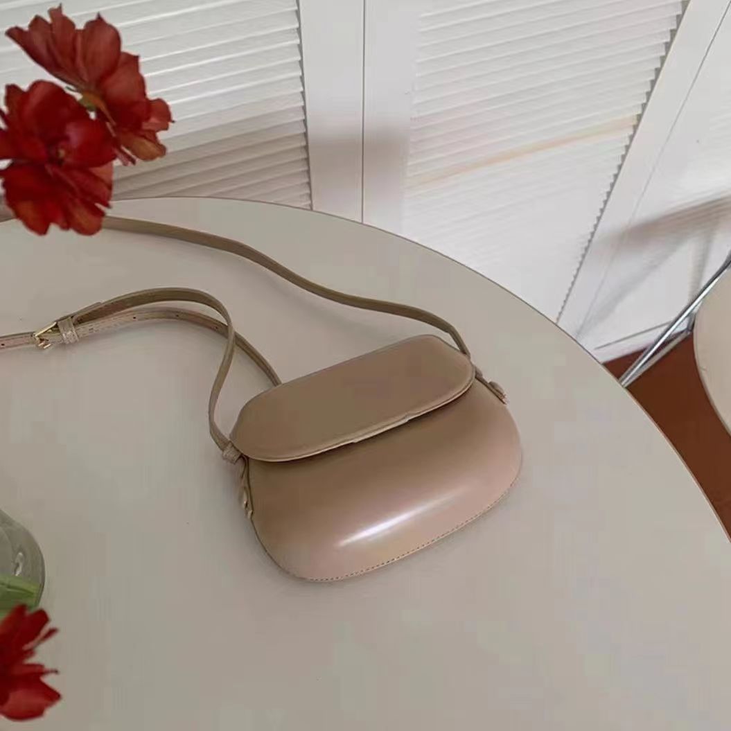 Curved Saddle Crossbody Bag with Flap Closure