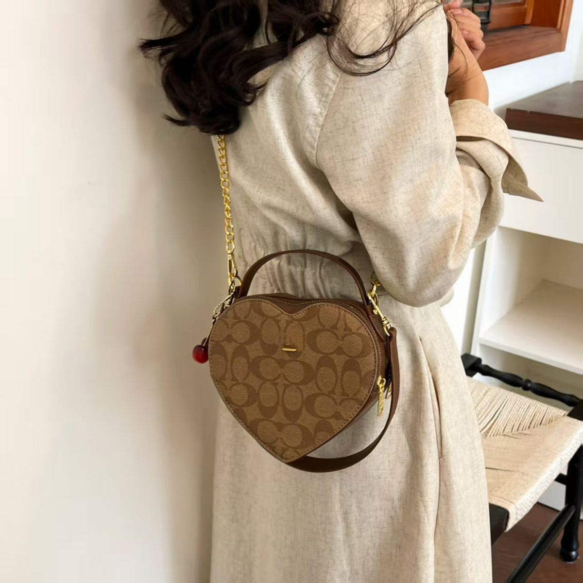Heart-Shaped Patterned Crossbody Bag with Top Handle, Chain Strap, and Cherry Charm