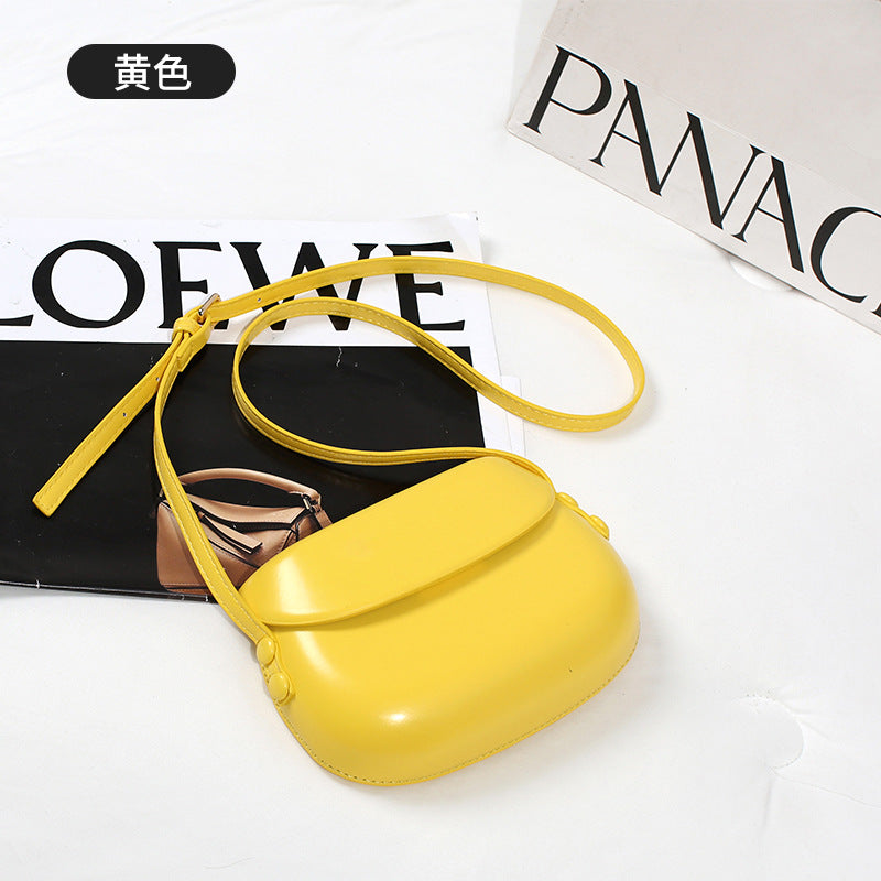 Curved Saddle Crossbody Bag with Flap Closure