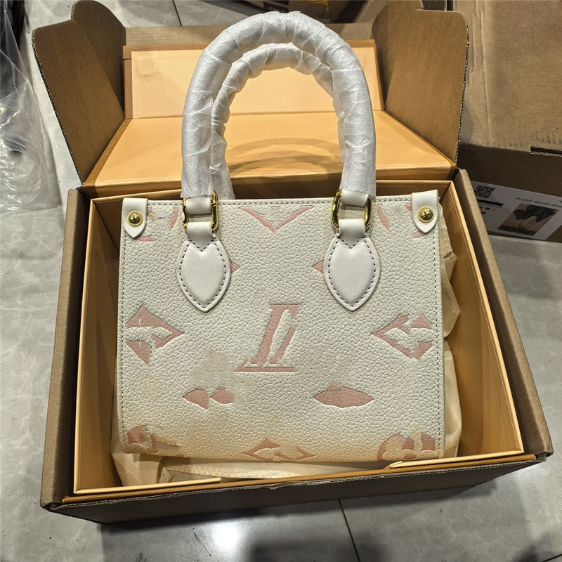 Off-white structured tote with pink monogram and gold hardware, ideal for women's work or leisure.
