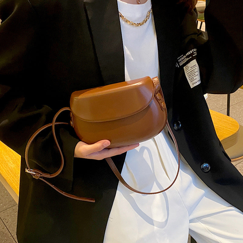 Curved Saddle Crossbody Bag with Flap Closure