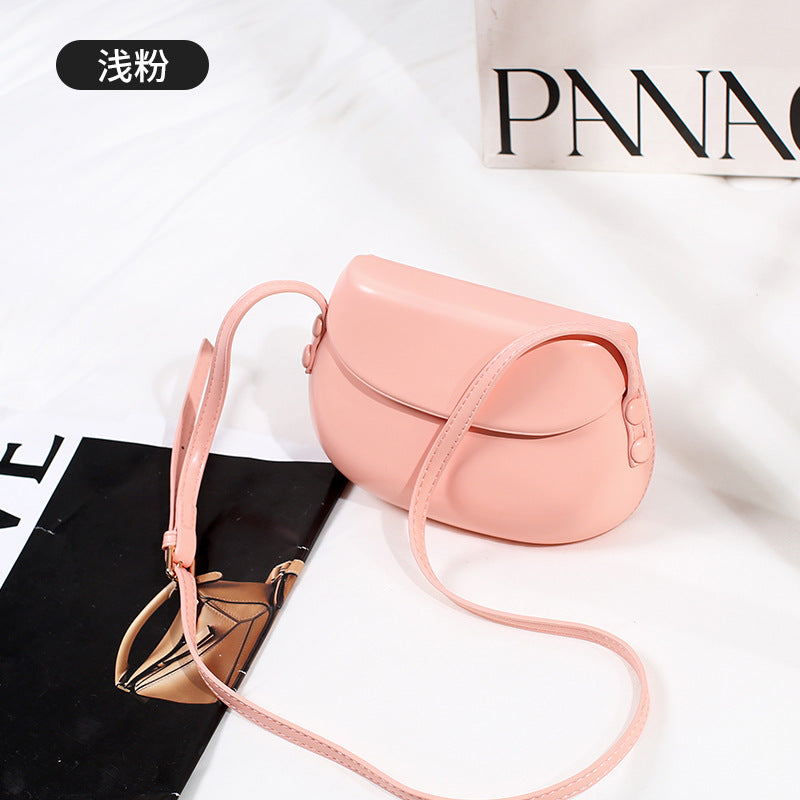 Curved Saddle Crossbody Bag with Flap Closure