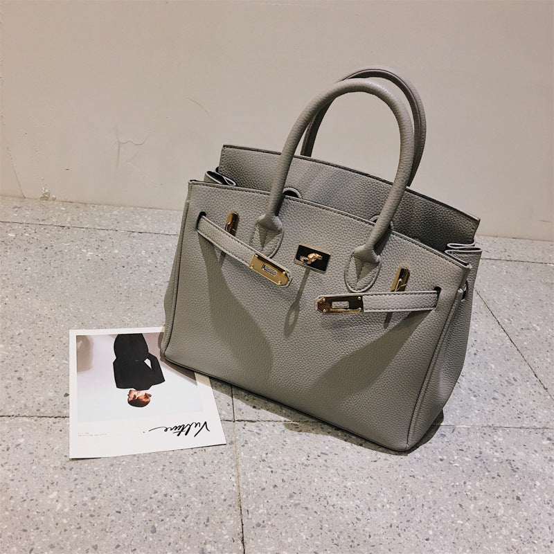 Structured Top-Handle Handbag with Shoulder Strap and Front Buckle Detail