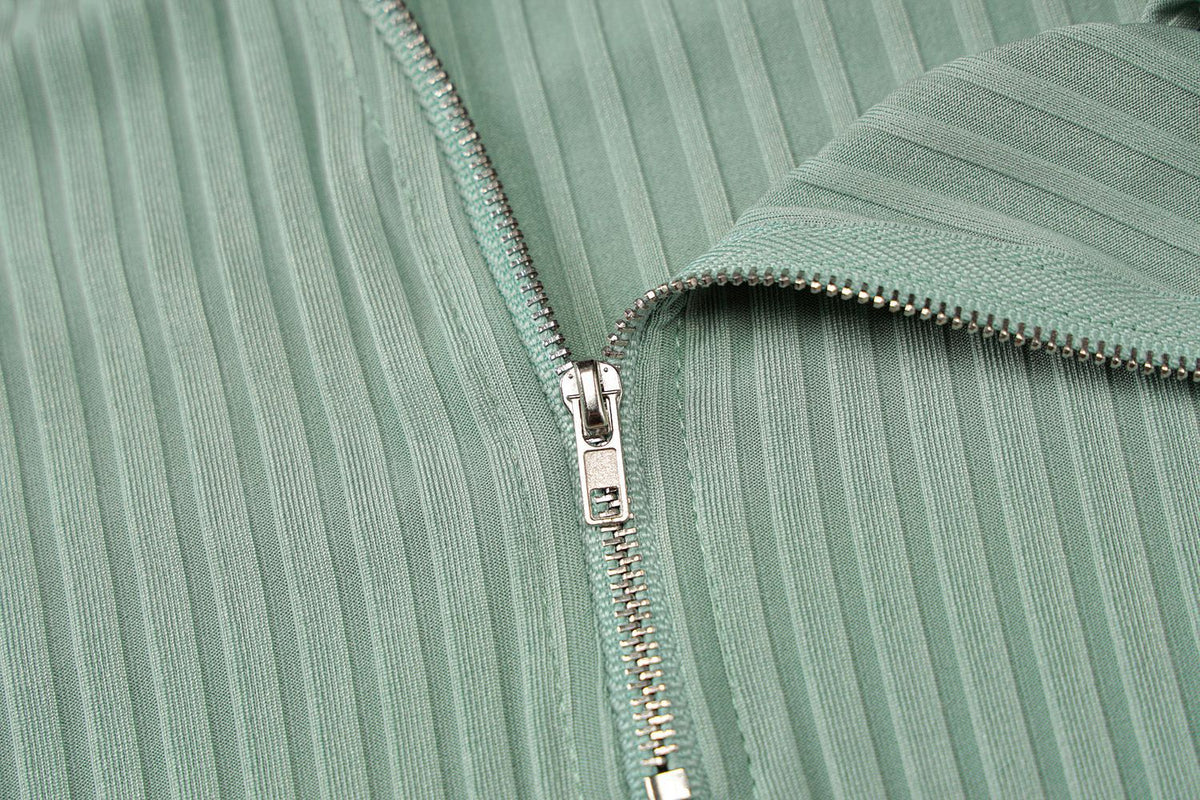 Ribbed Sleeveless Mini Dress with Front Zip and Plunging Neckline