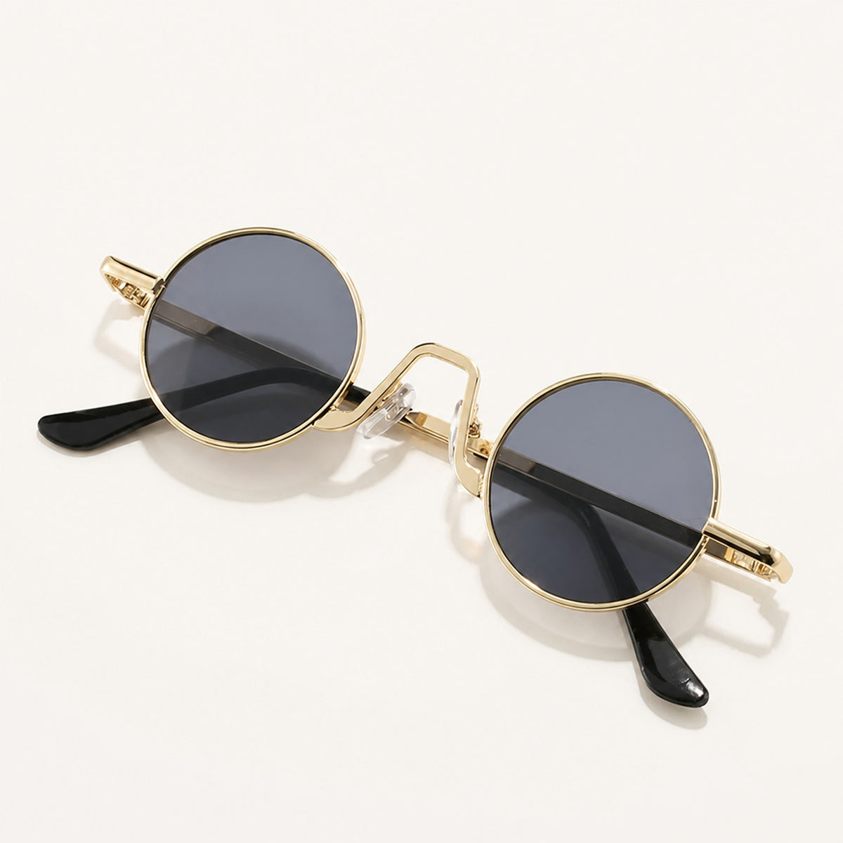 Small Round Sunglasses with Geometric Bridge and Sun Protection