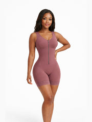 African American woman in a modern indoor setting wearing seamless Luxe Front Zip Thigh Shaper, showcasing a confident pose and fitted silhouette.