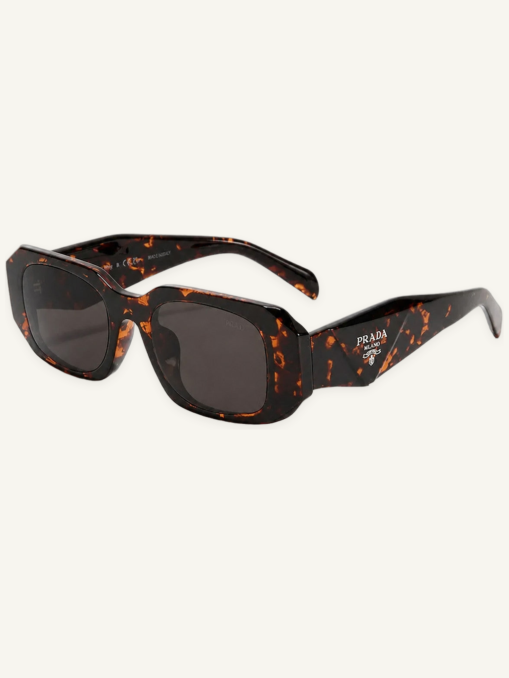 Tortoise square frame sunglasses with dark lenses and Prada logo on temple for driving and UV protection.